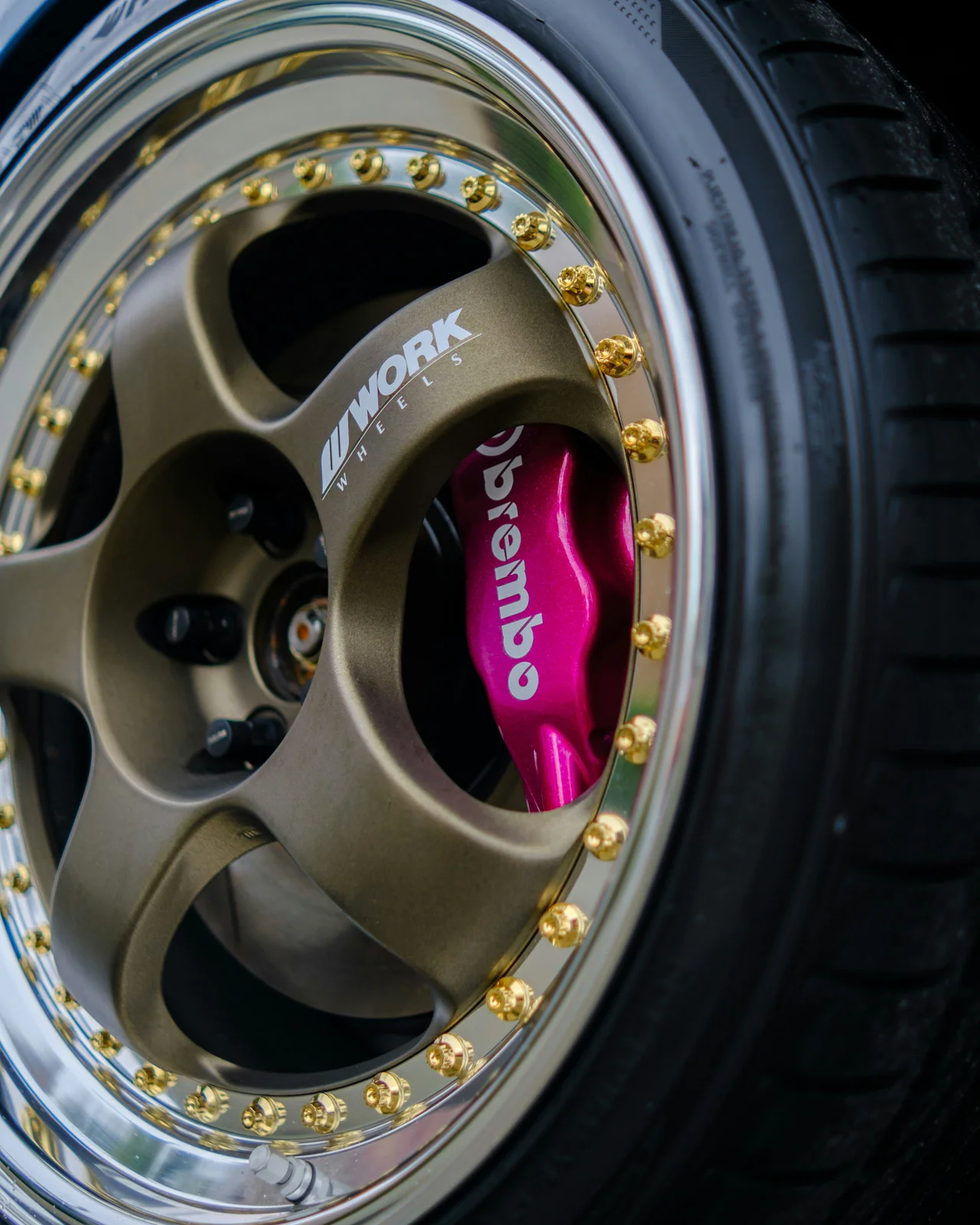 Close-up of a Work Meister S1 3P with Pink Brembo Calipers